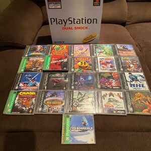 SONY PLAYSTATION 1 WITH 2 CONTROLLERS/2 MEMORY CARDS & 22 GAMES